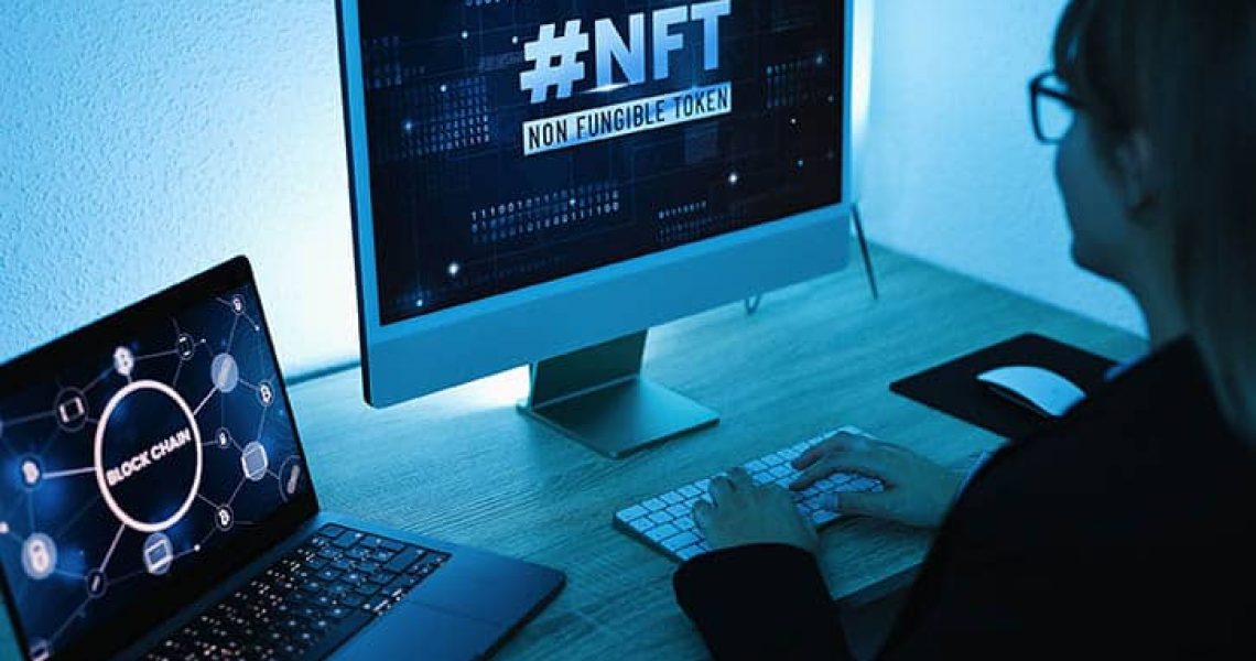Young woman buying NFT on Blockchain market - New Technology Token Concept - Focus on right computer screen